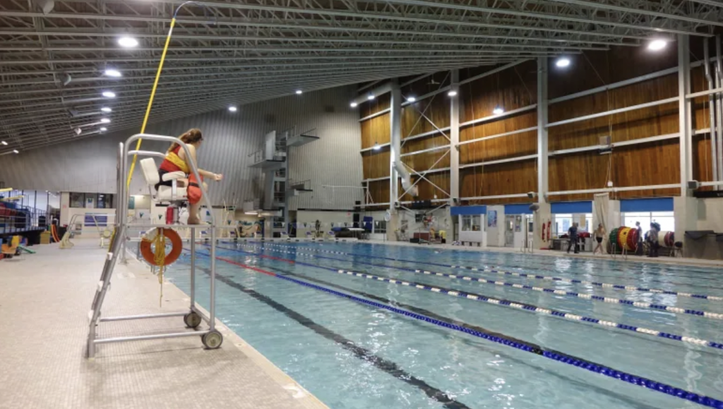 Girls in swimsuits are undressed after swimming pool in locker room Stock  Photo